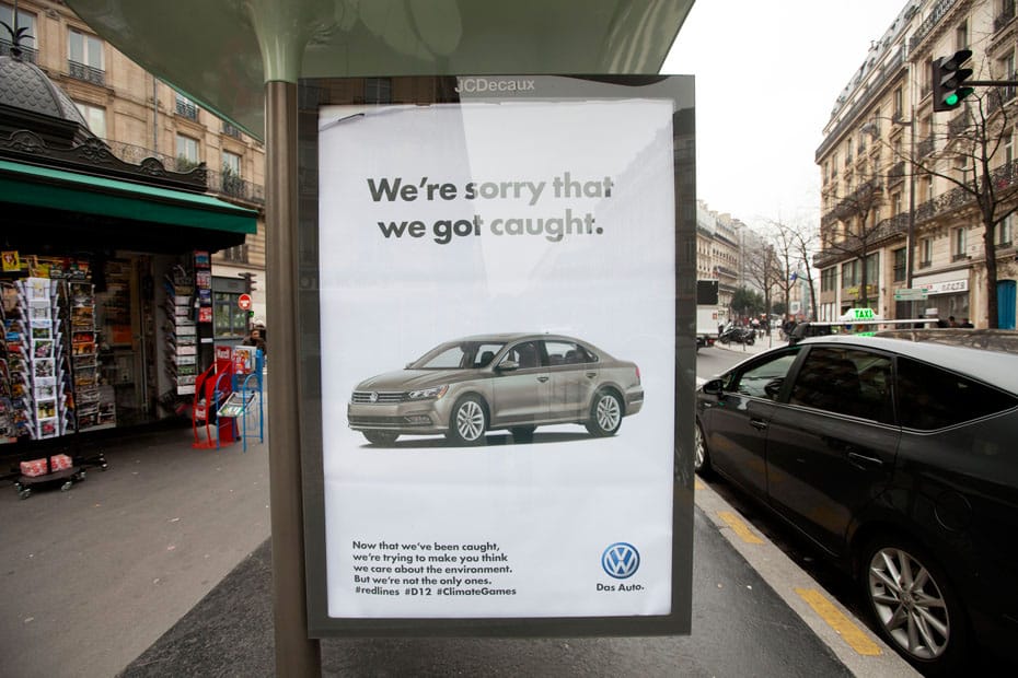 a bus shelter with a climate protest poster