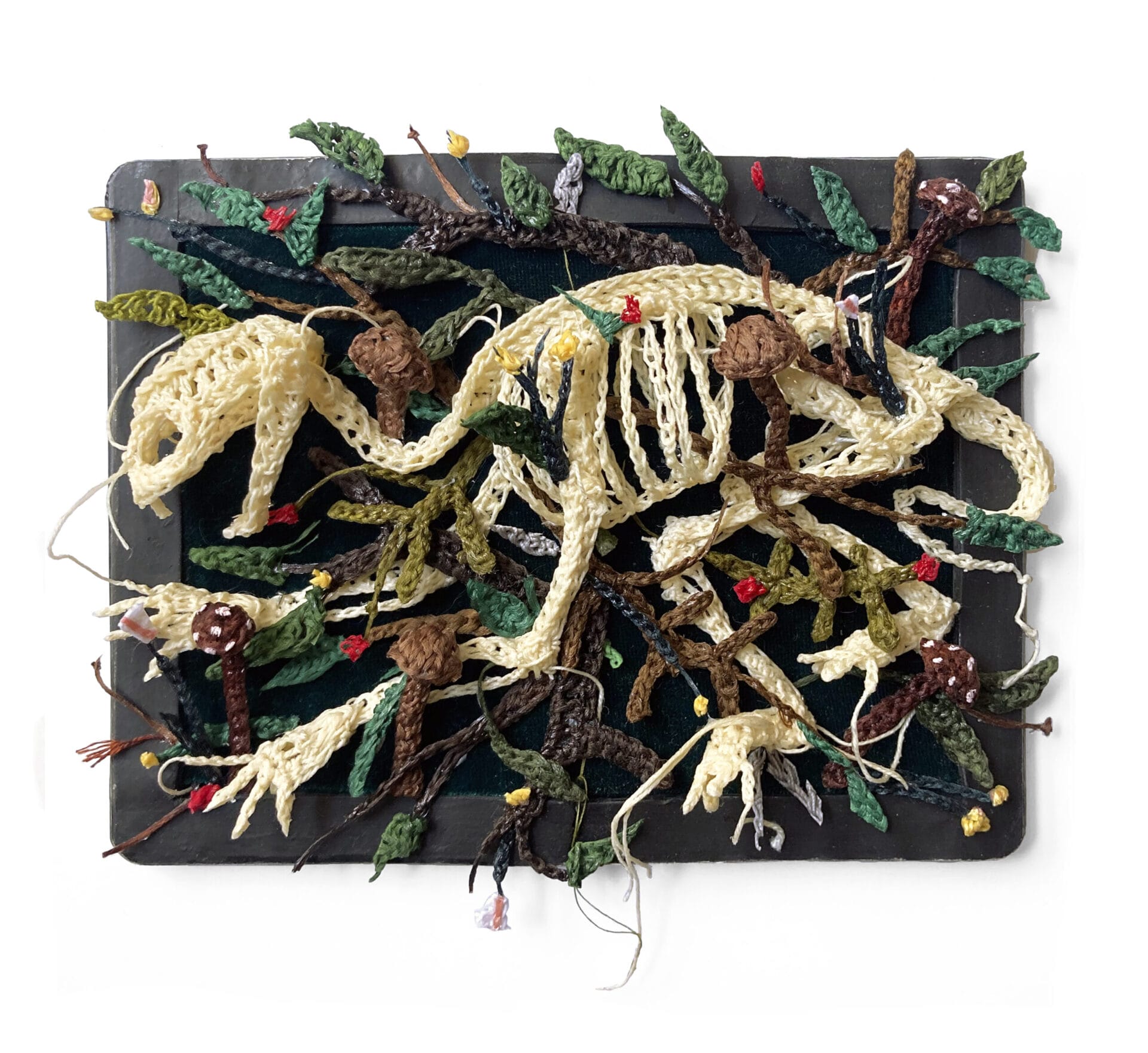 Crocheted fiber that looks like tiny skeletons on the ground.