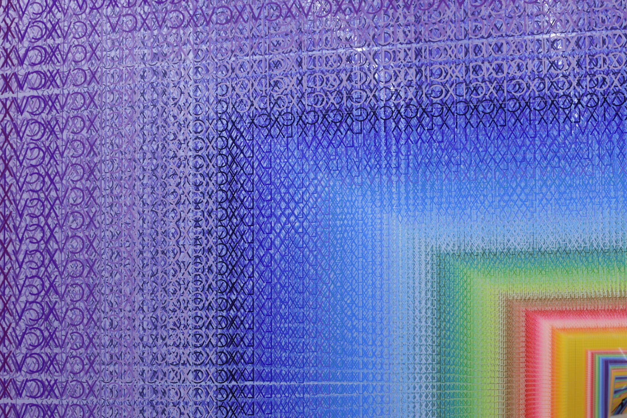 A rainbow-like gradient of Roman numerals installed in a corridor. The colors change from purple to blue to green to orange to pink.