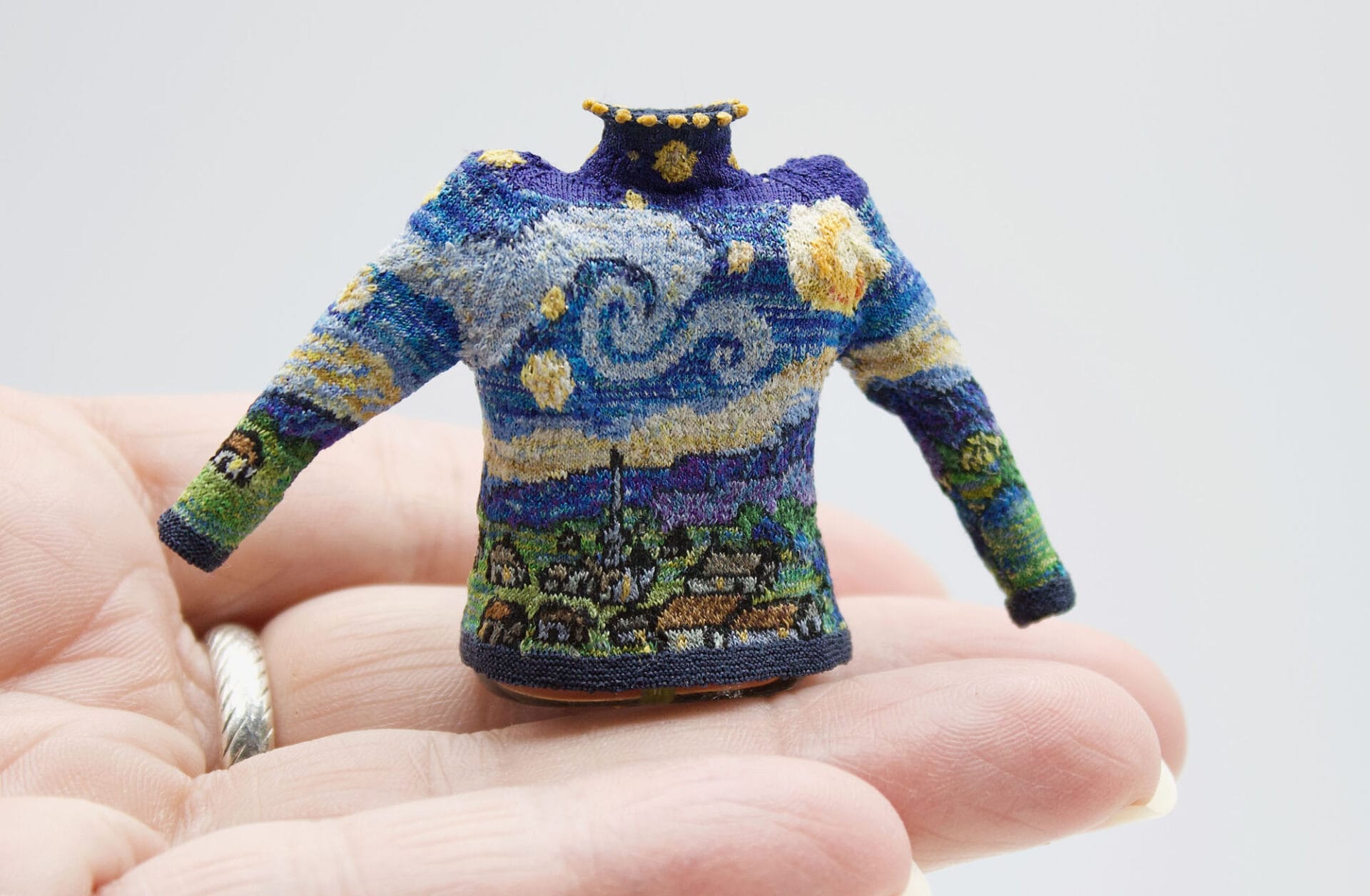 a miniature knit cardigan inspired by Van Gogh's "Starry Night"