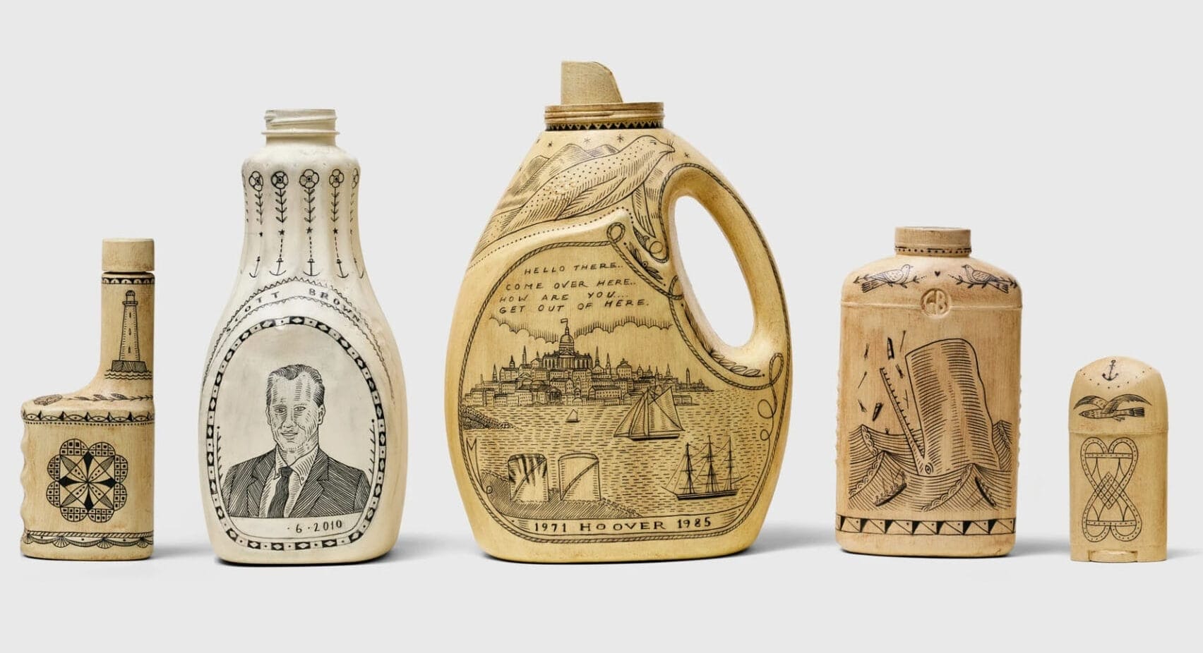 repurposed containers and bottles from household products are painted beige and carved into, emulating traditional scrimshaw art