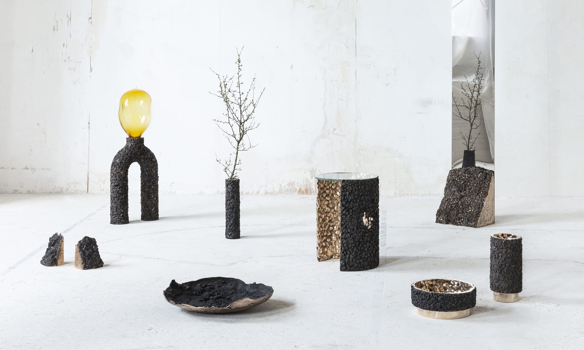 Abstract furniture/decor made to look like wood bark on a white concrete background