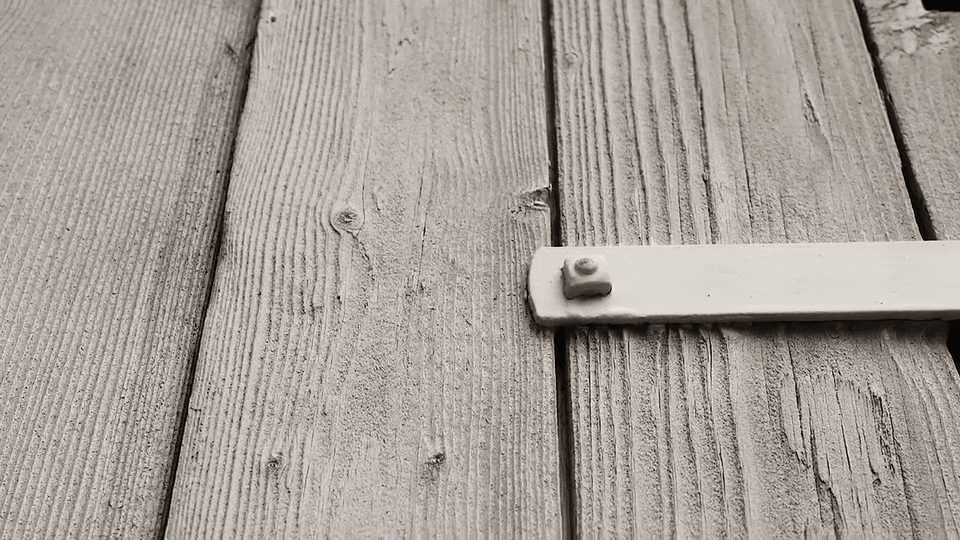 a gif of wooden doors rattlign