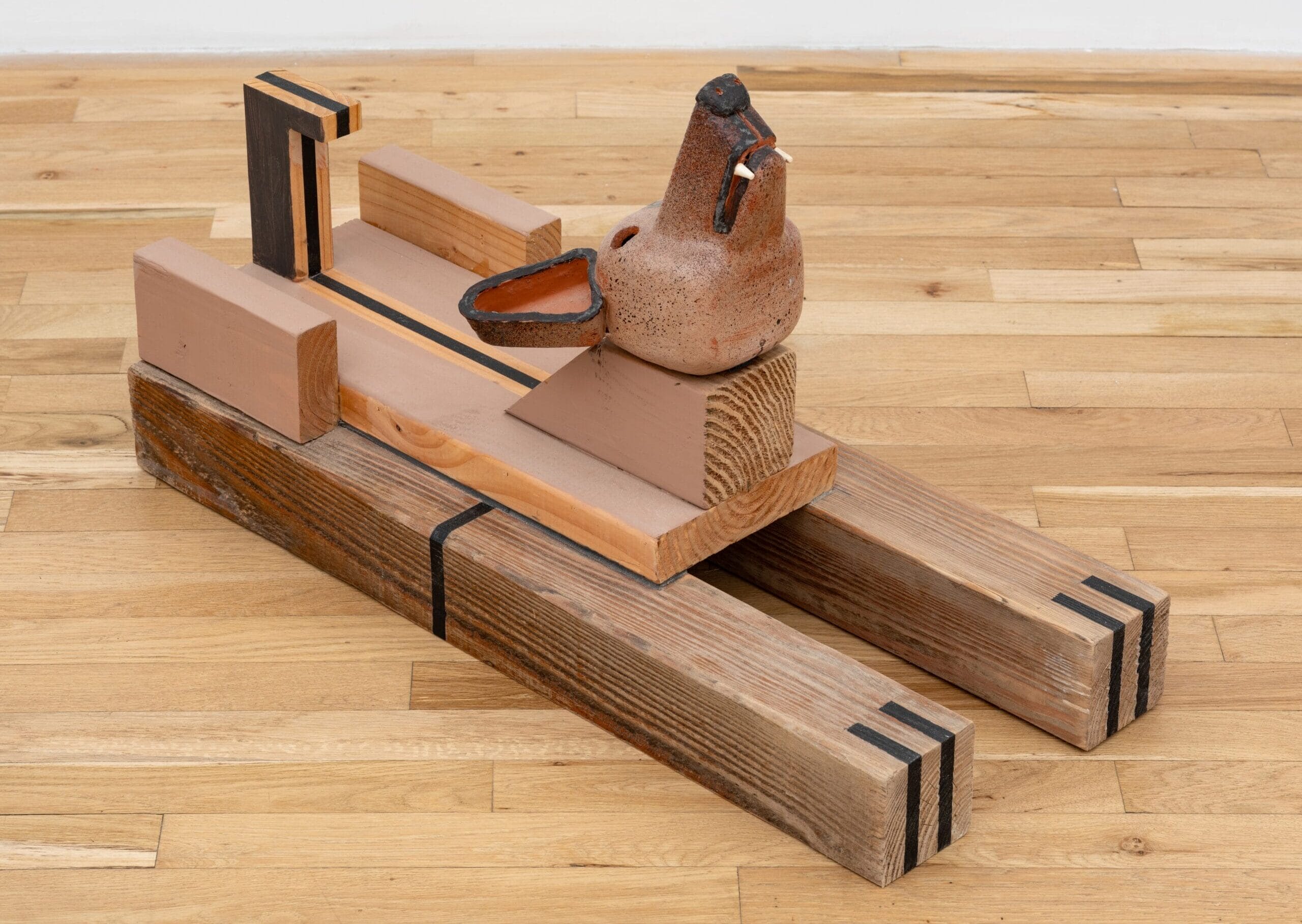 a floor sculpture by Steve Keister of a blocky wolf
