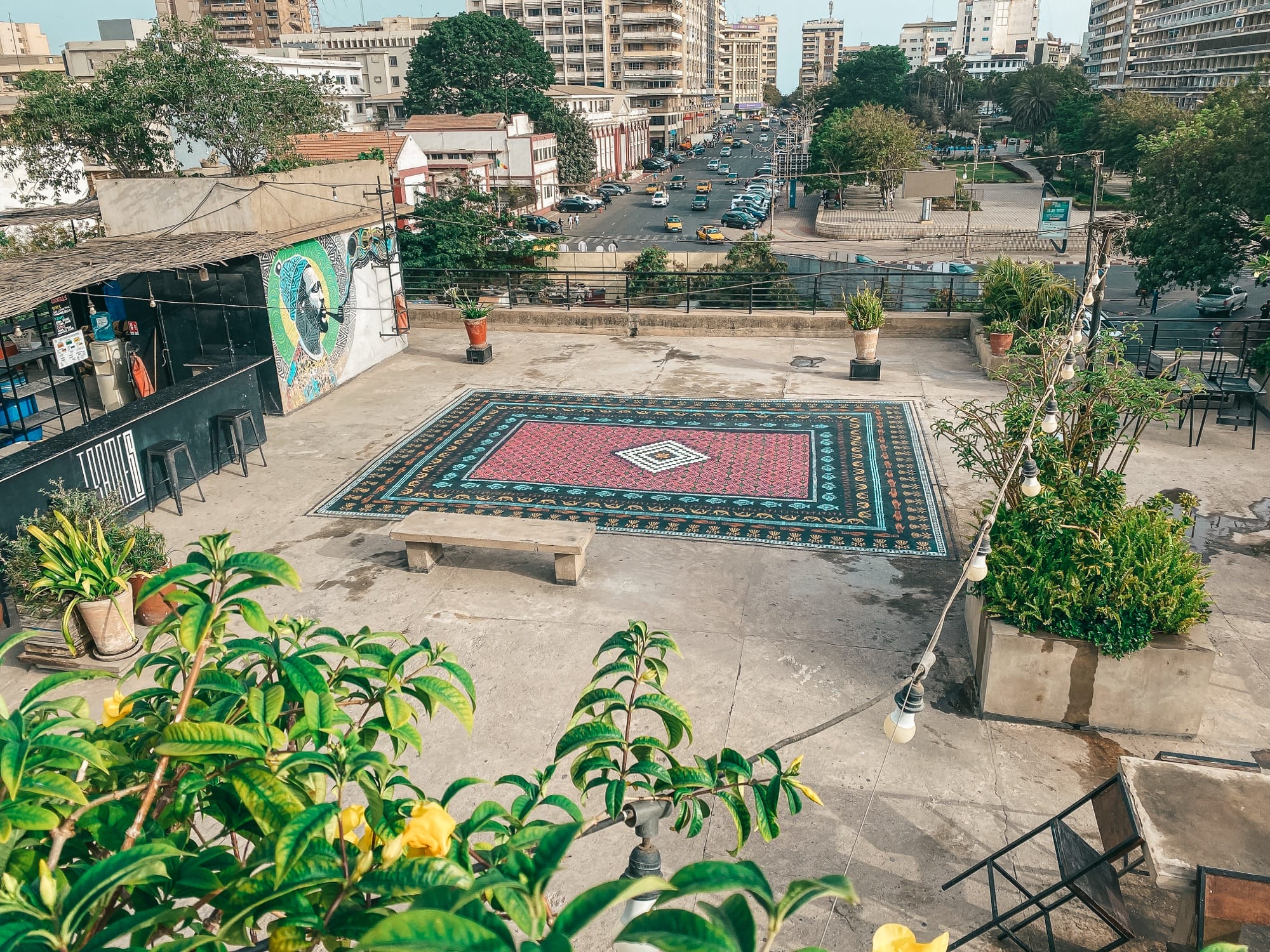 a spray-painted ornate carpet on a rooftop in Dakar