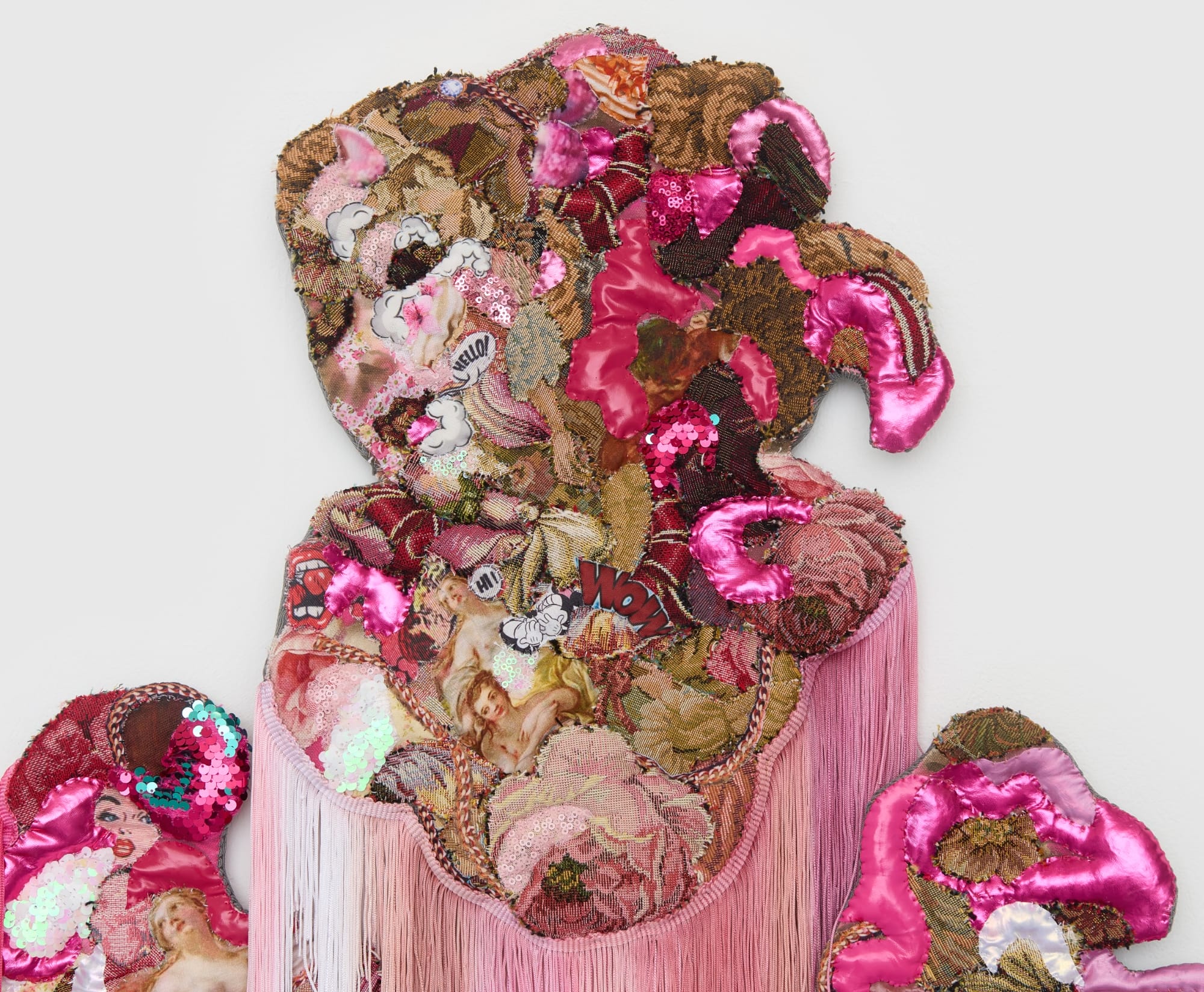 a monumental, abstract wall installation by Anne von Freyburg that appears to be cascading in pink and brown hues. a face appears at the top