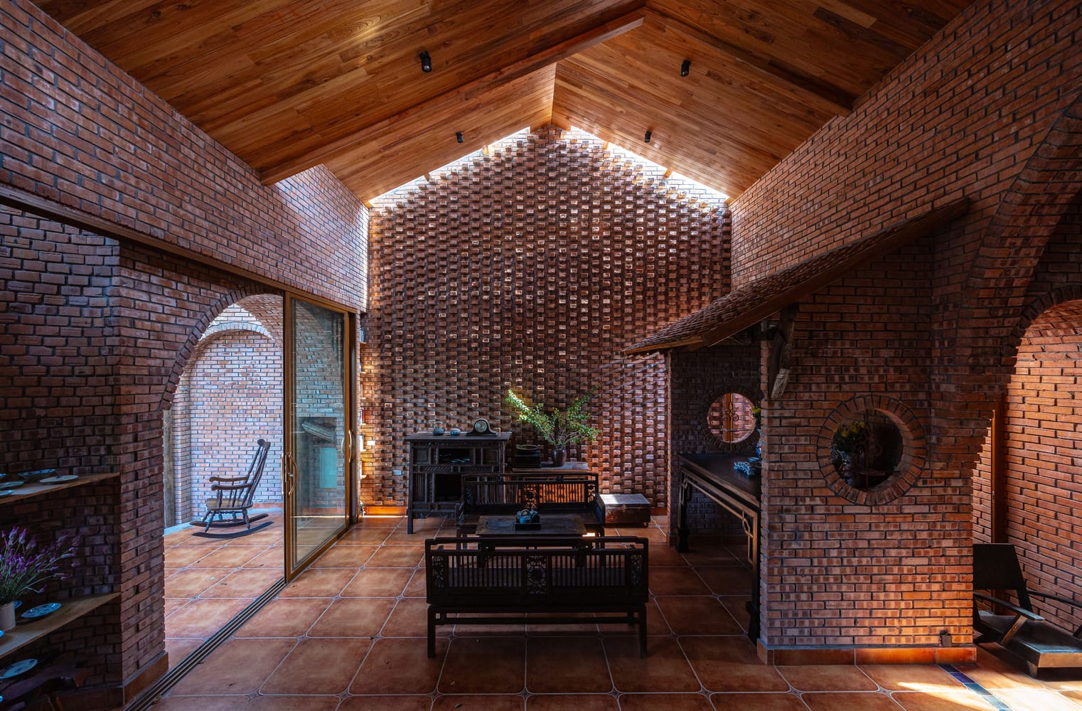 A living room of a contemporary brick house in rural Vietnam