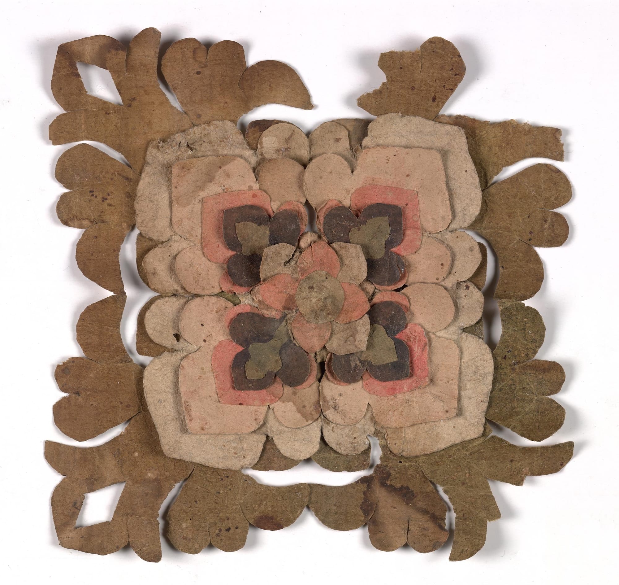 A cut and folded paper flower found in a cave in China, dating to the Tang dynasty