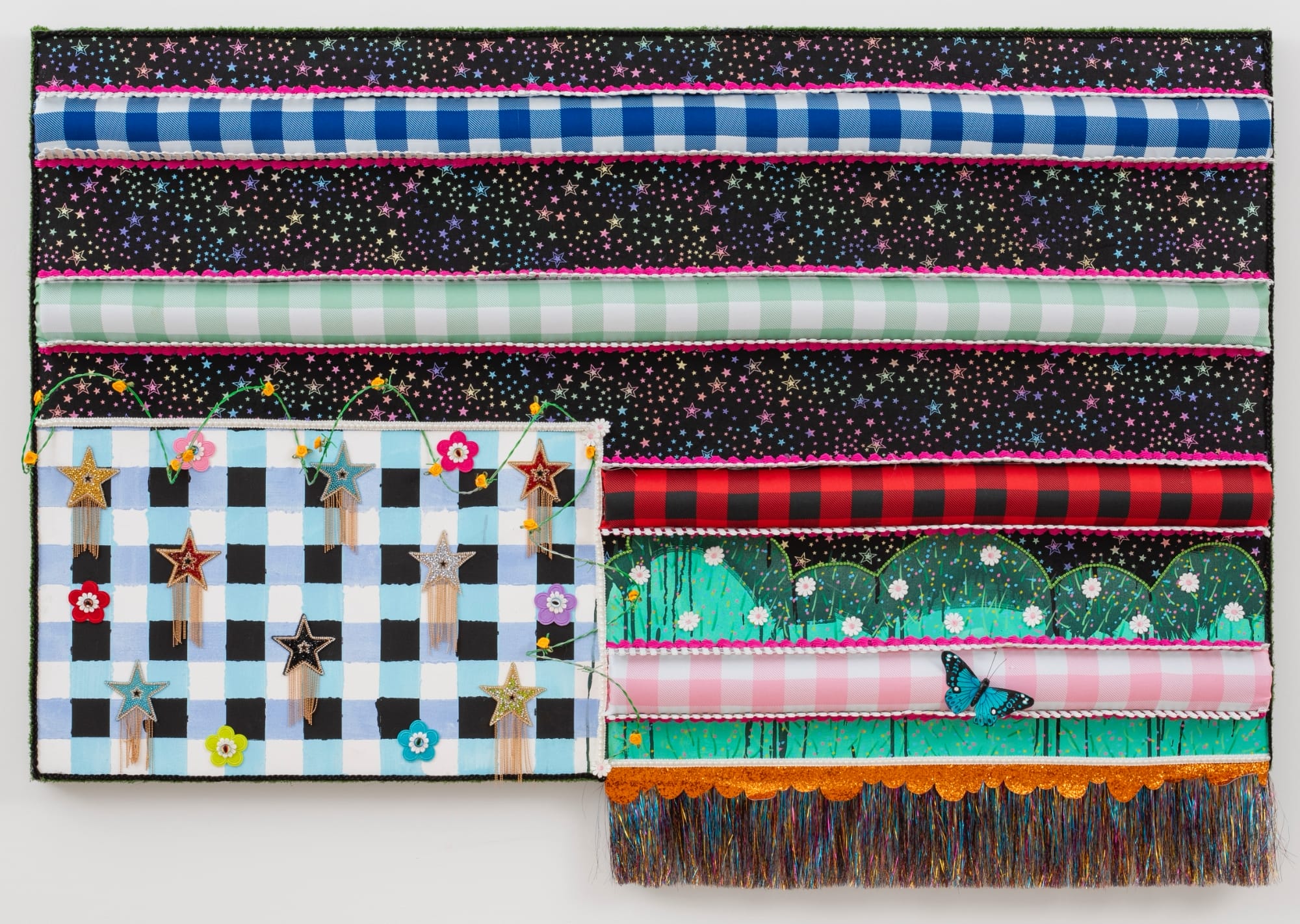 a colorful, patterned textile flag with fringe and glitter by Victoria Dugger