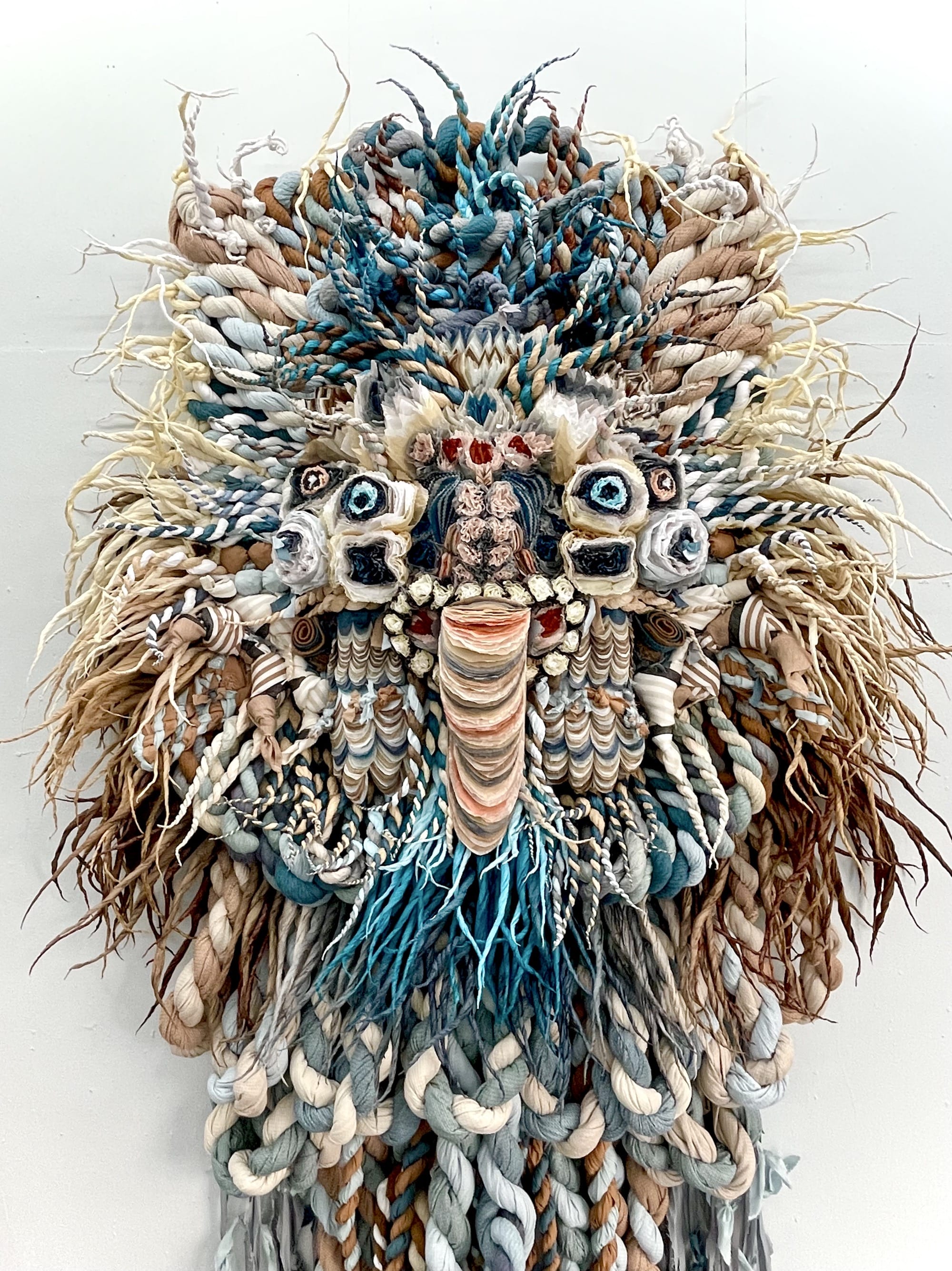 a lush, almost abstract paper mask sculpture with tendrils , florals, and other intricate details by Marianne Eriksen Scott-Hansen