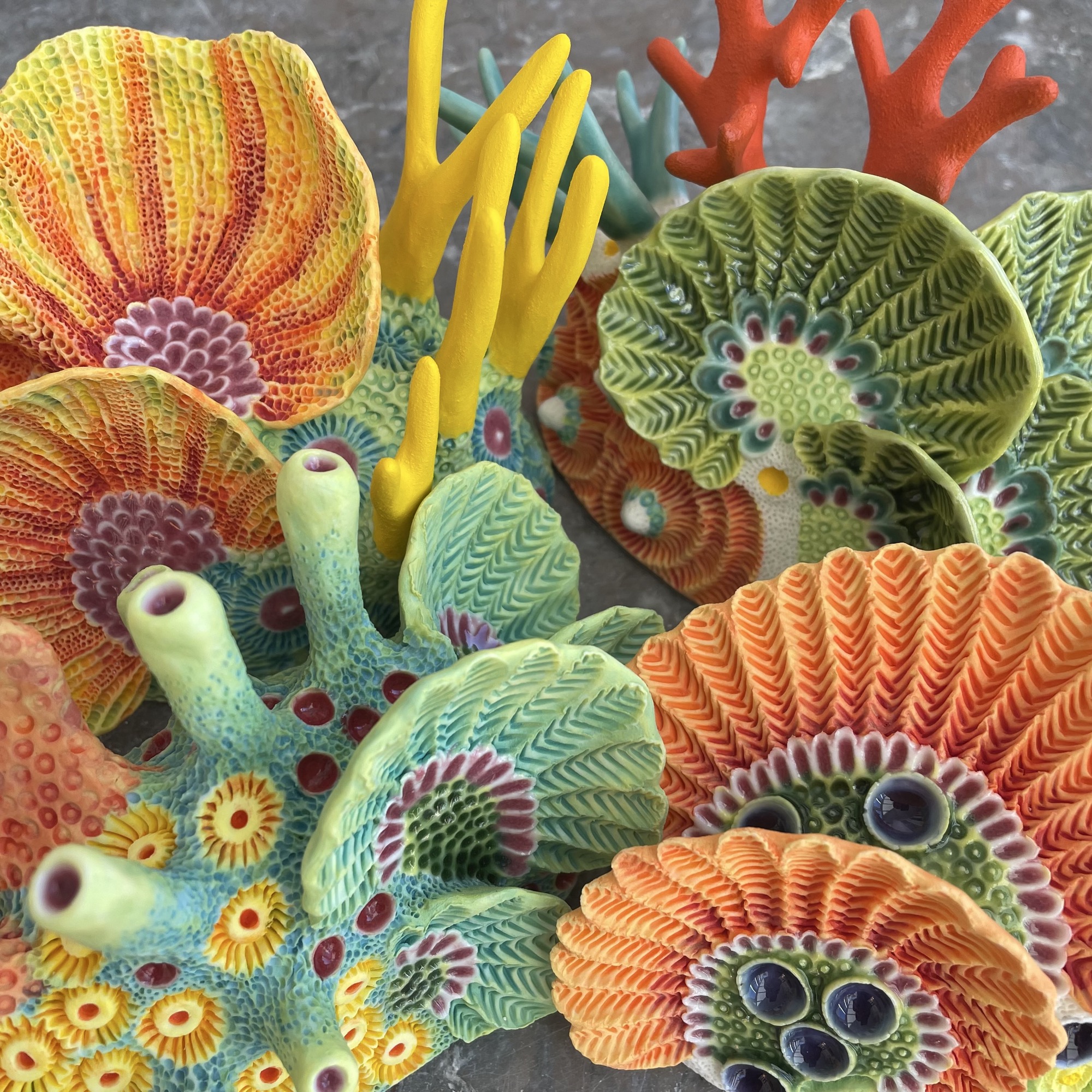 a selection of coral-inspired, colorful ceramic sculptures by Lisa Stevens