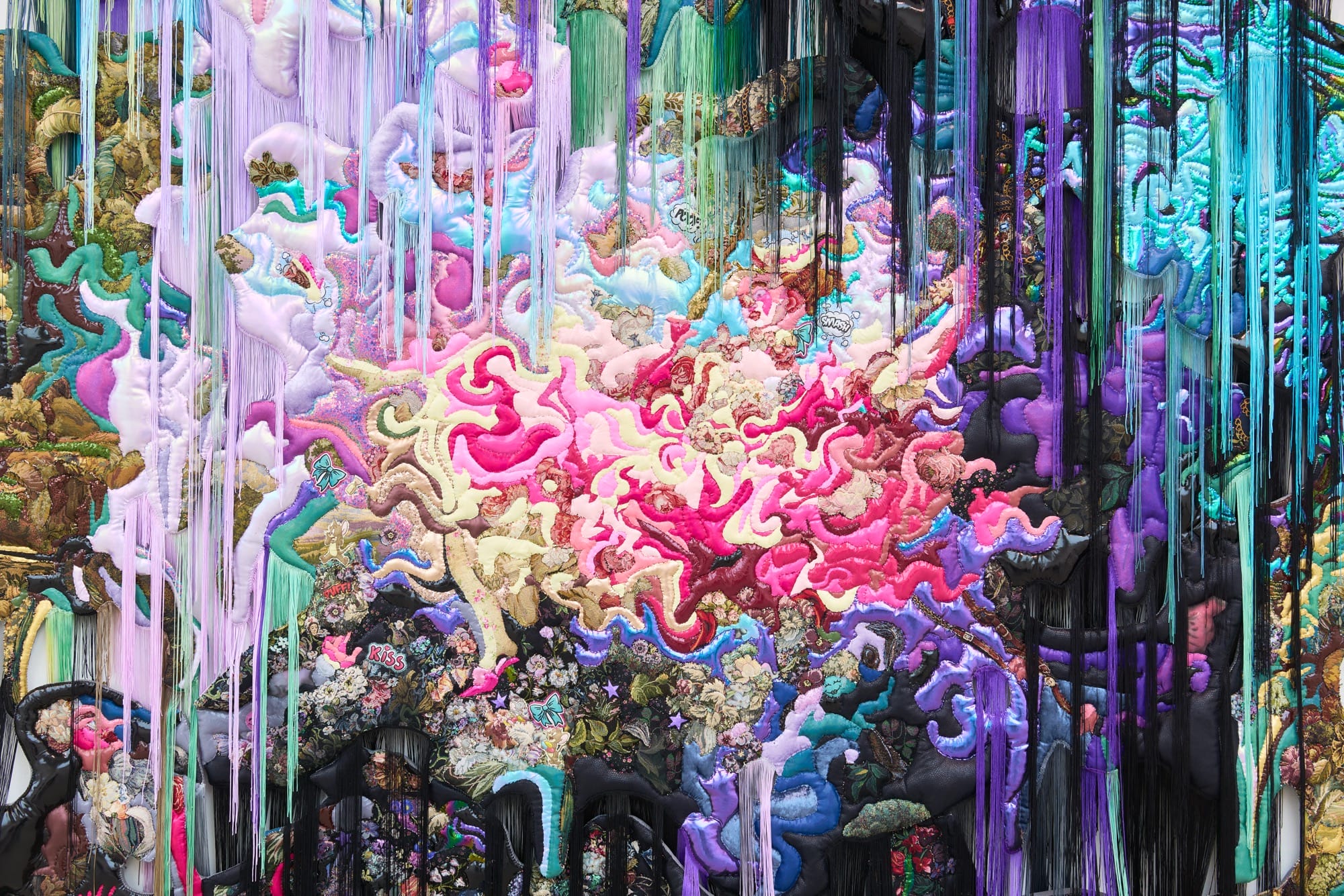 a detail of a colorful, abstract textile work by Anne von Freyburg