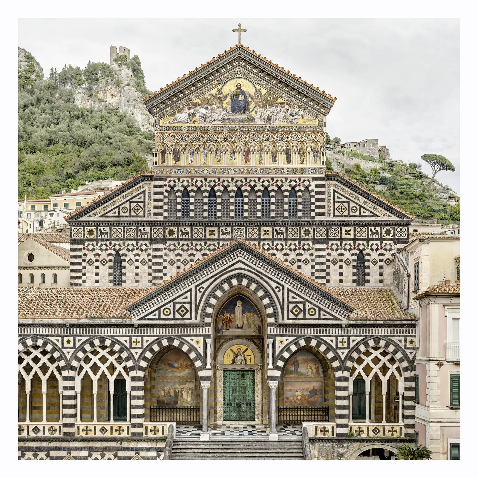 A fine art photograph by Marcus Brunetti of the facade of an ornate black-and-white church in Amalfi, Italy