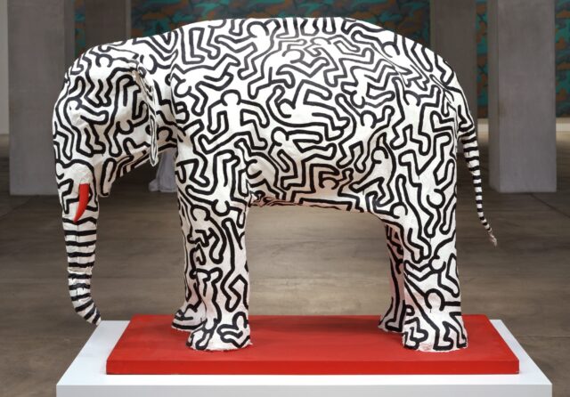 a papier-mache sculpture of an elephant with black line drawings all over it in a pattern